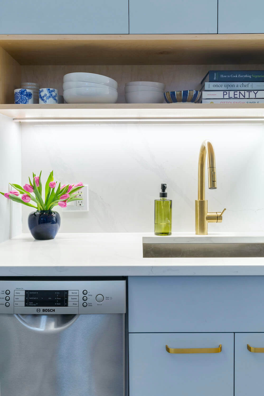 Image of a kitchen with brass fixtures and open shelving