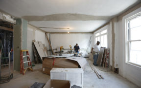 workers remodelling a living room during renovation