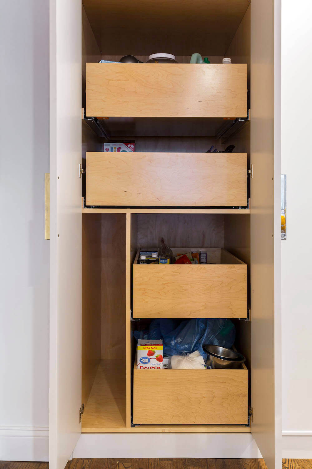 Natural brown wooden pull out storage with for pantry after renovation