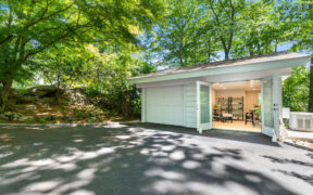 one part of two car detached garage converted to room and sectional door replaced with see through glass doors during renovation
