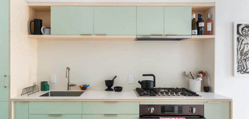 light green kitchen cabinets with white countertop in bronx rowhouse remodel