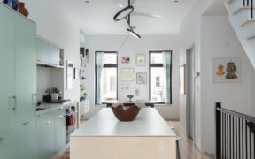 Sea green open kitchen with white counter kitchen island in bronx rowhouse remodel