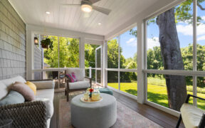 sunroom with wood floors and  recessed lights fan and vinyl ceiling with access to deck after renovation