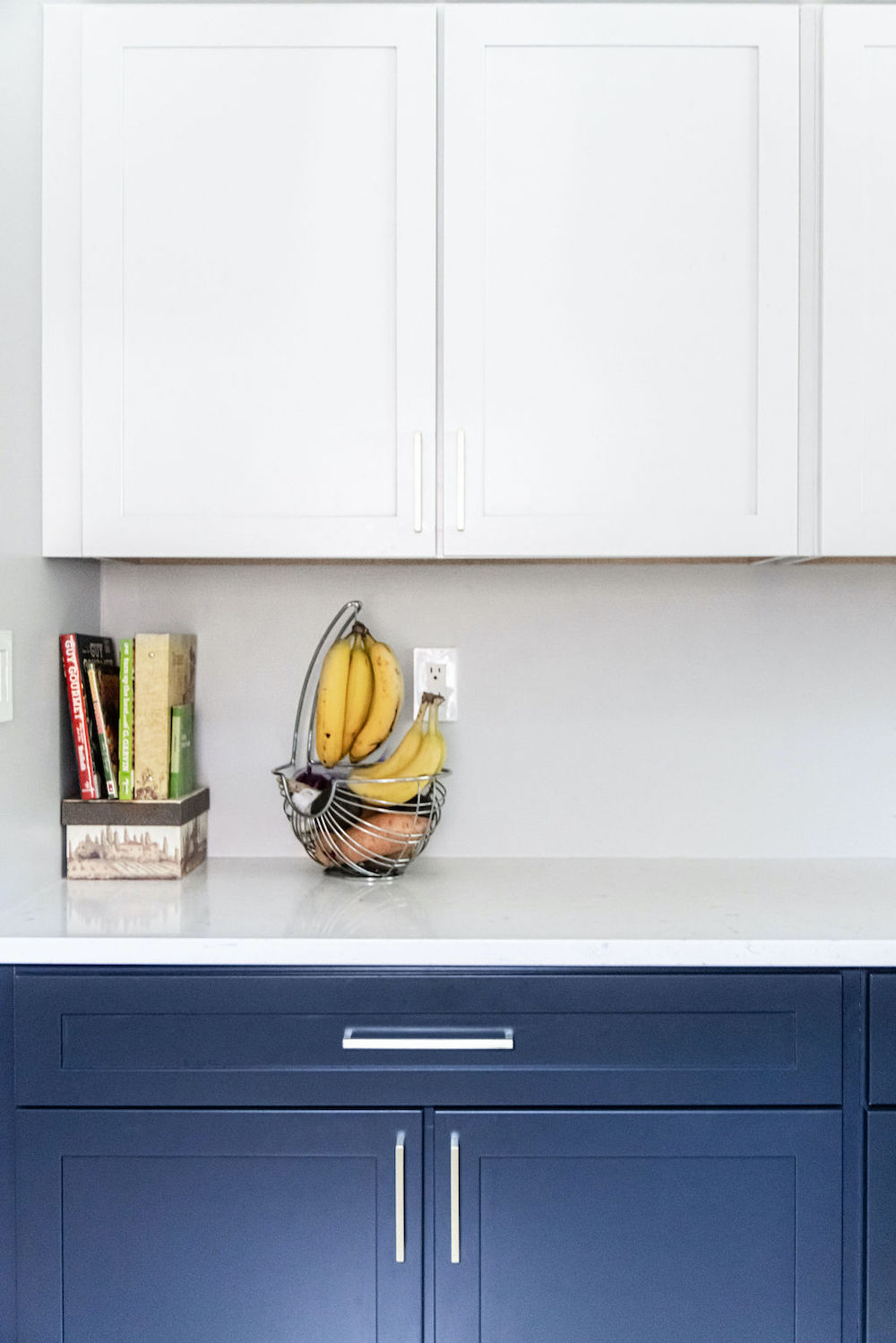 Modern blue and white cabinetry with white countertops