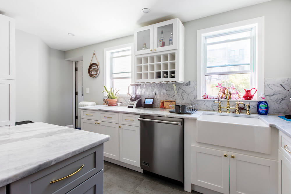 White and gray kitchen cabinets with kitchen island after renovation
