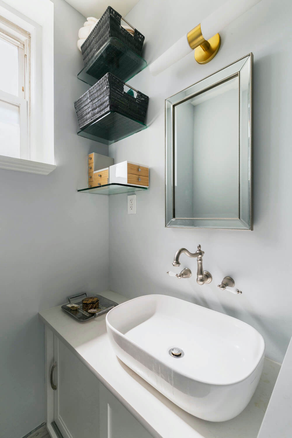 Bathroom vanity with vessel sink and glass shelving