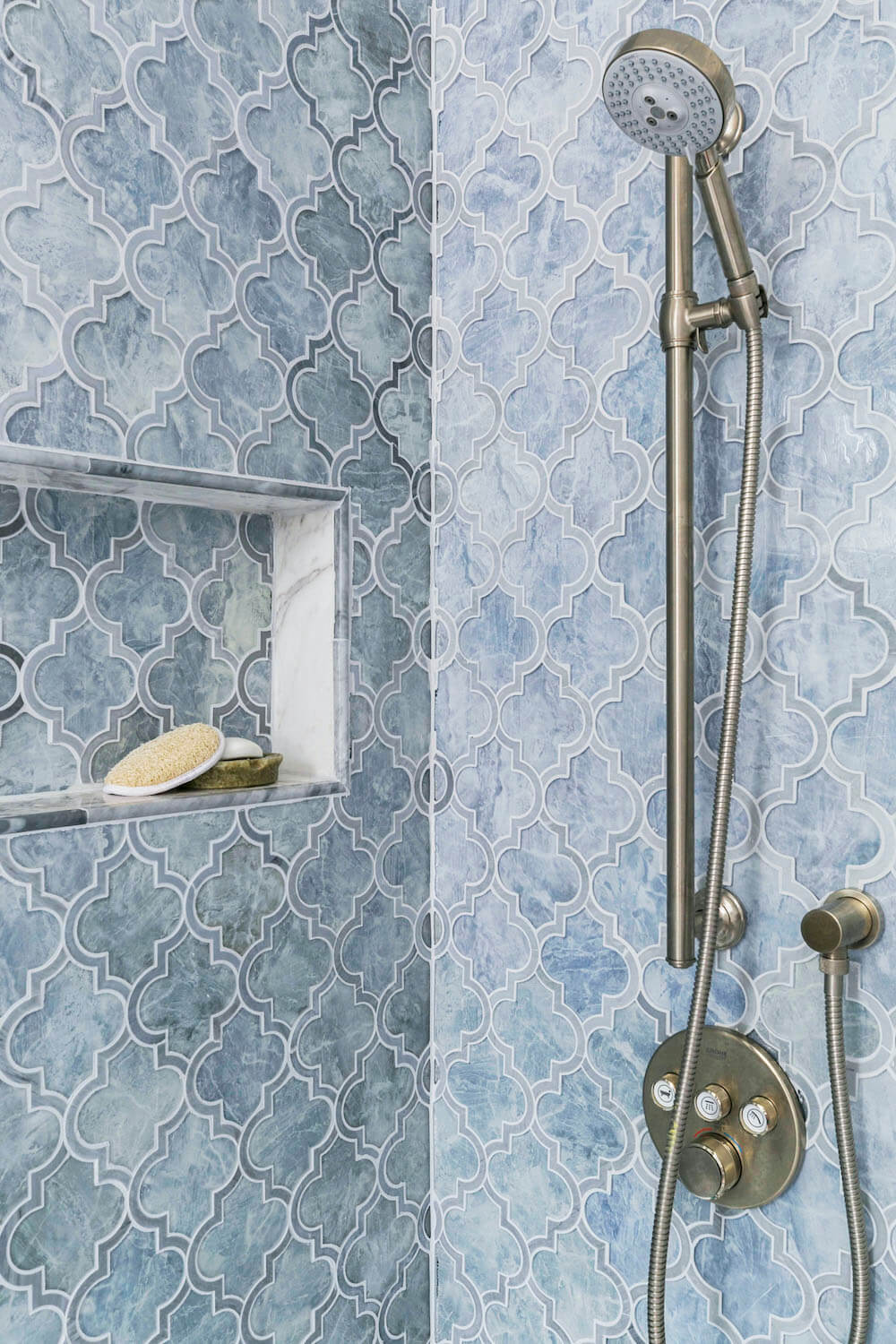 Shower with irregularly shaped blue tiles