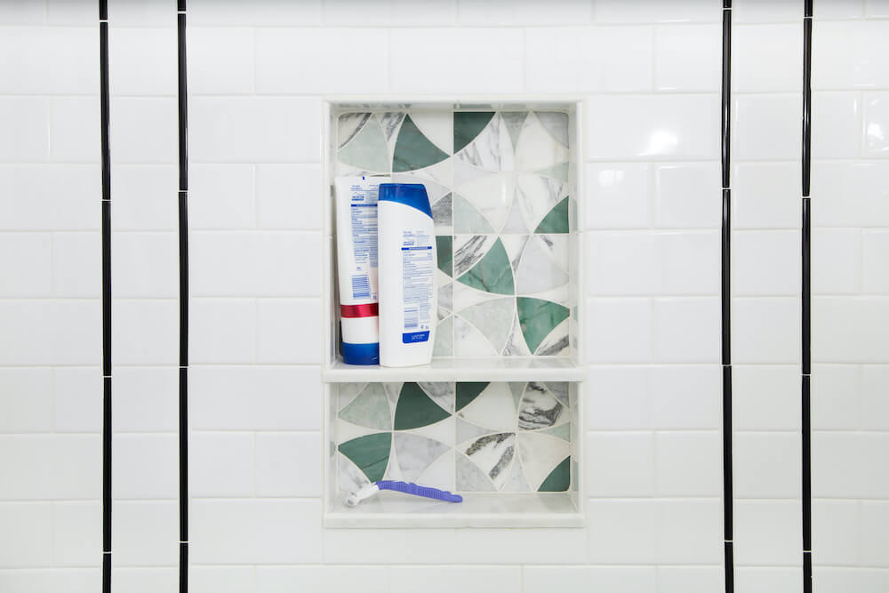 Stylized shower niche with tile that matched the floor