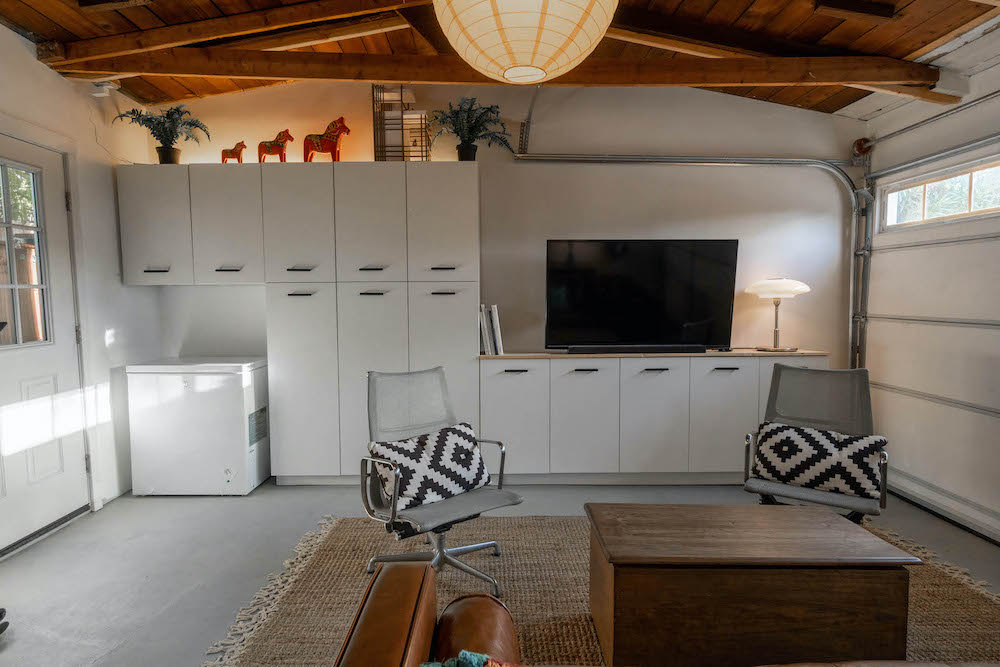 Garage white cabinets with television