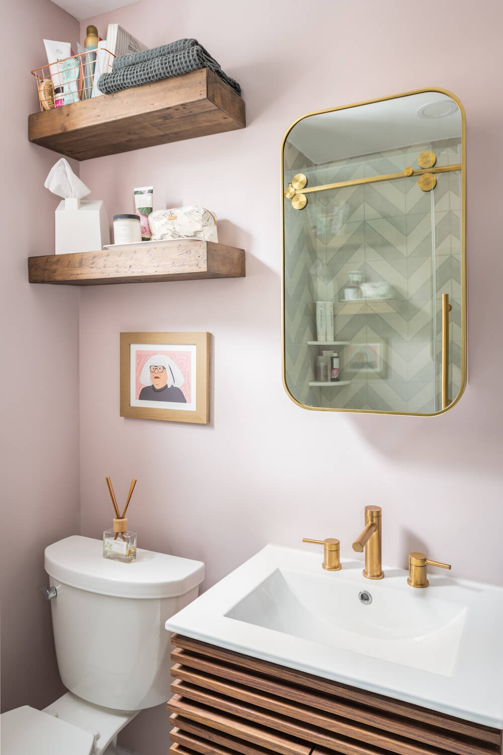 Bathroom with pink walls and wooden open shelving