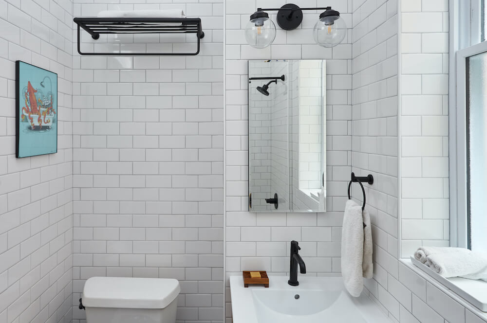 Bathroom with white subway tile and matte black fixtures
