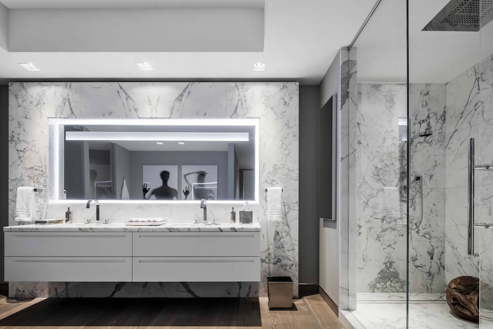 Marble bathroom with white double floating vanity