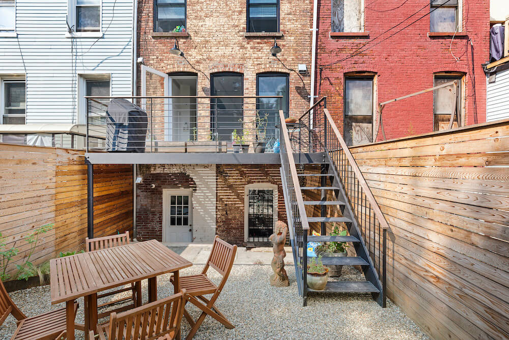 A backyard in NYC with a patio and a seating area