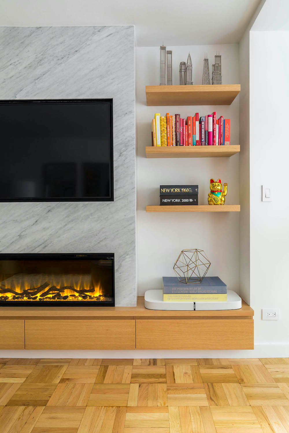 Fireplace with open wooden bookshelves