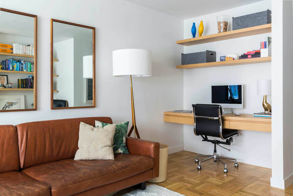 Home office area with open wooden shelves