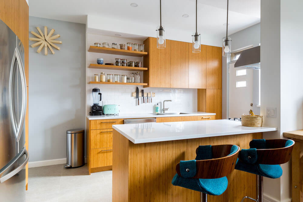 Kitchen with wooden cabinets and white countertops