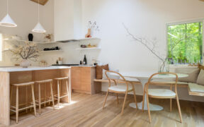 natural wood Kitchen cabinets with adjacent breakfast nook