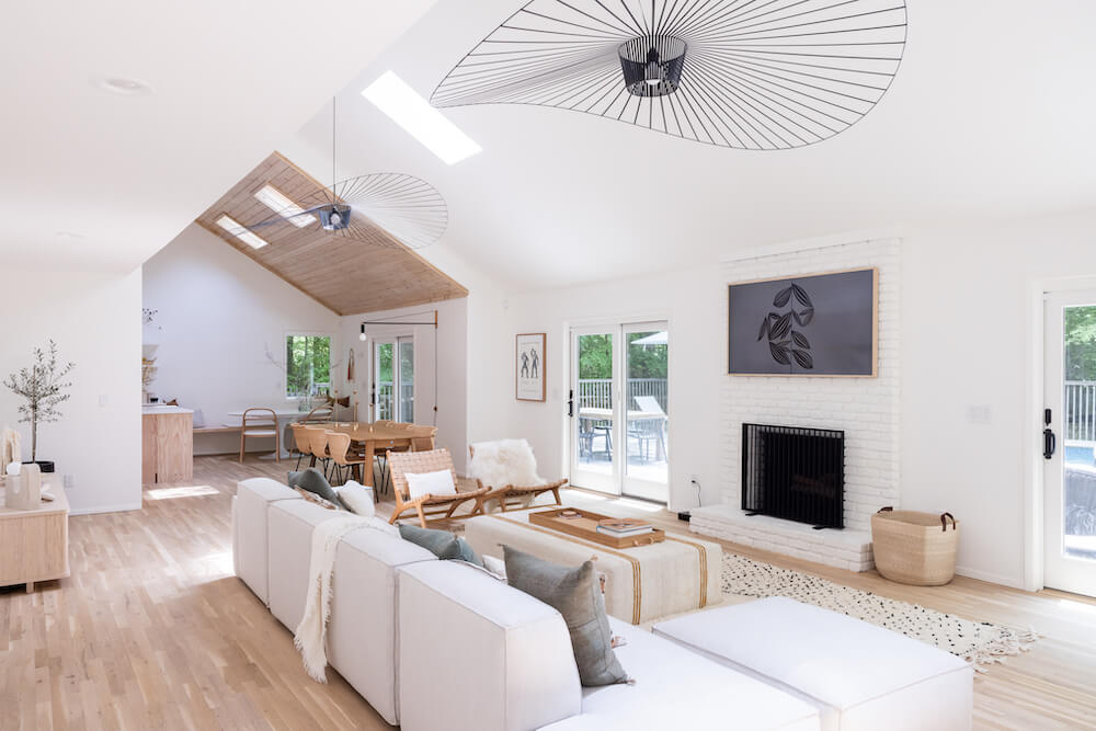 Living area with white fireplace and decorative fans