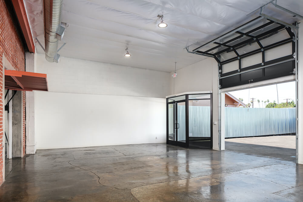 Large open space with glass doors and garage door