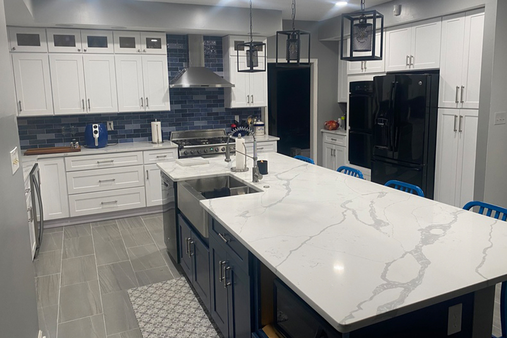 Kitchen with large island and white marble counter