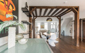 Indoor wood arbor over dining area