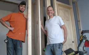 Two GCs posing at a work site