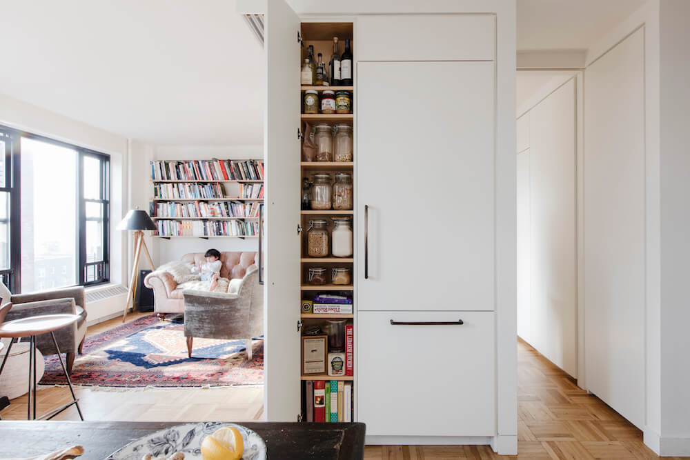 Pantry storage next to panel ready fridge