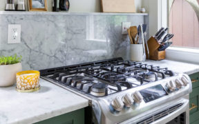 White granite kitchen countertop and backsplash with range