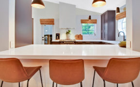 Three leather bar stools at the serving hatch