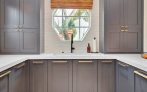 gray kitchen cabinets with gold hardware