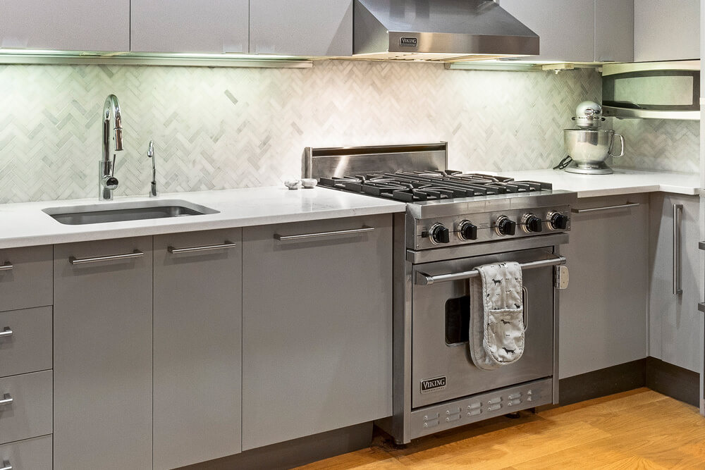dark-gray-kitchen-cabinets-and white countertops