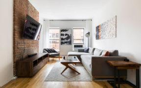 small living room with exposed brick wall