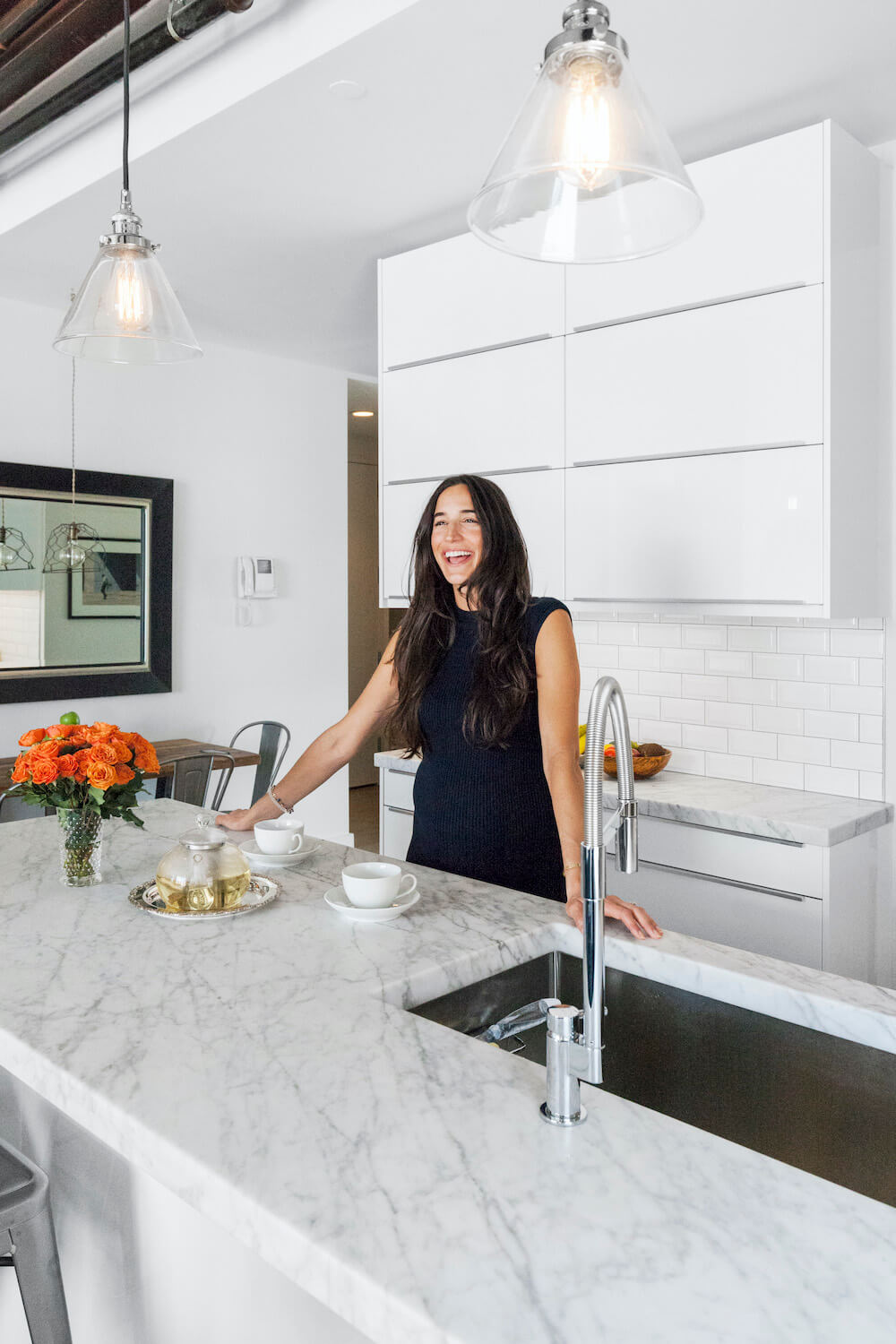 Candid shot of Lia in her kitchen renovated with Sweeten