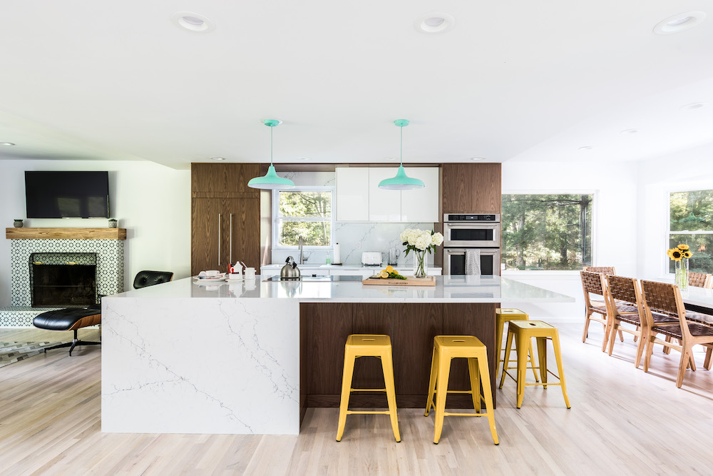 Kitchen with quartz island and yellow stools