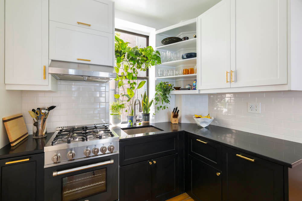 L-shaped black and white kitchen cabinets