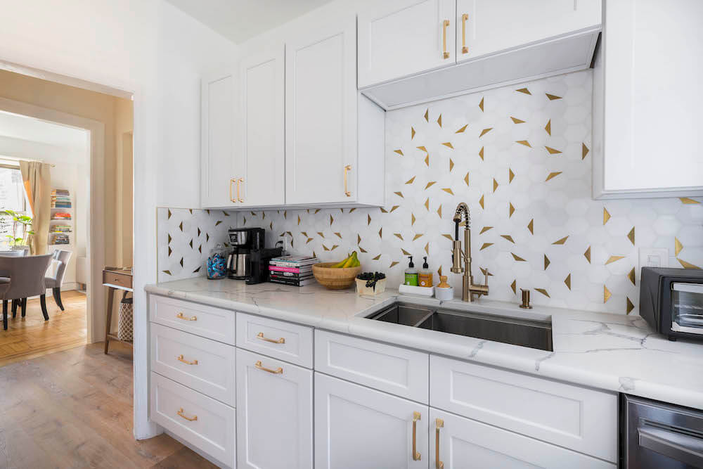 White and gold kitchen backsplash tile