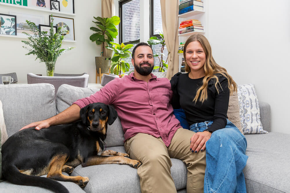 Portrait of the Sweeten homeowners with their dog