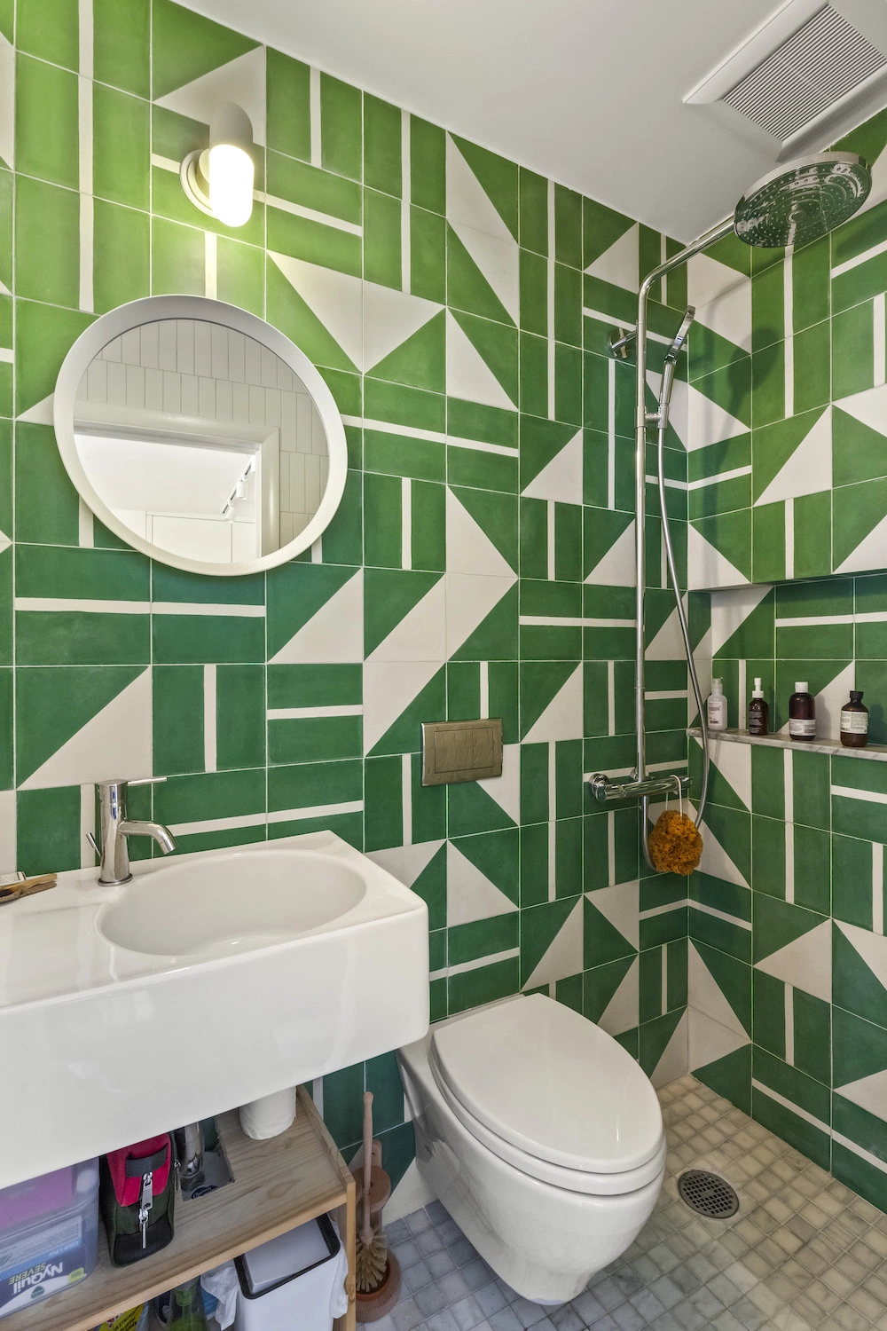 Wet room style bathroom with green tile