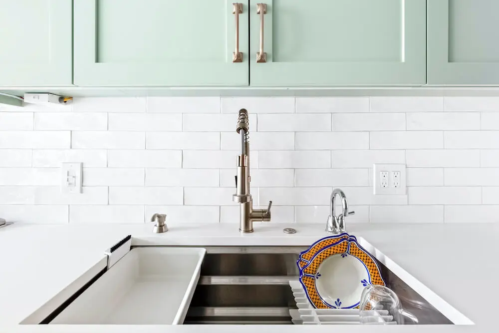 Kitchen remodel with white tile backsplash