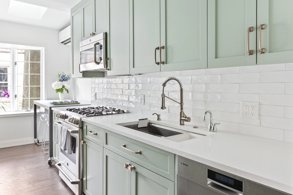 Galley kitchen remodel with mint green cabinets