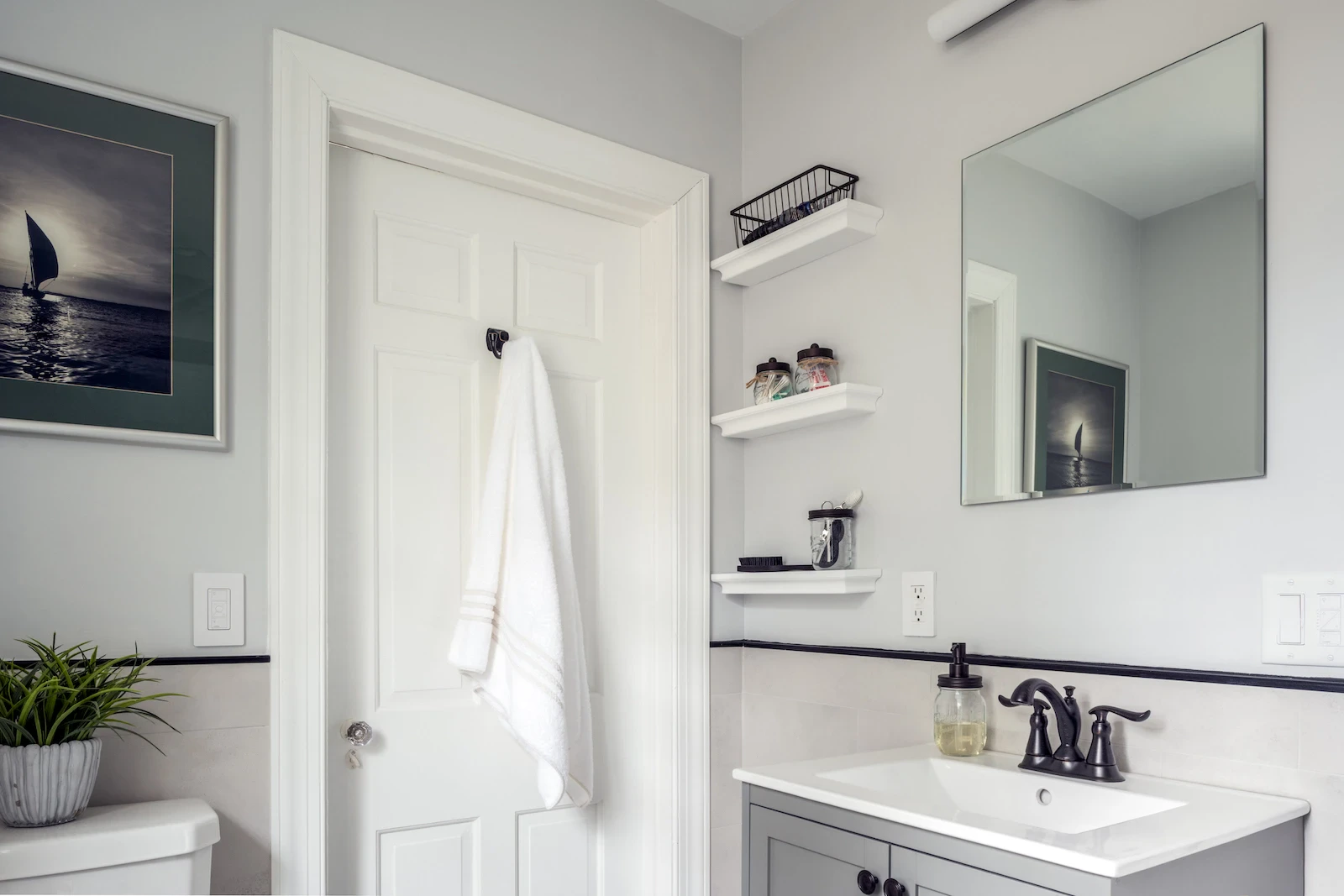 Gray vanity black fixtures bathroom remodel in Philadelphia