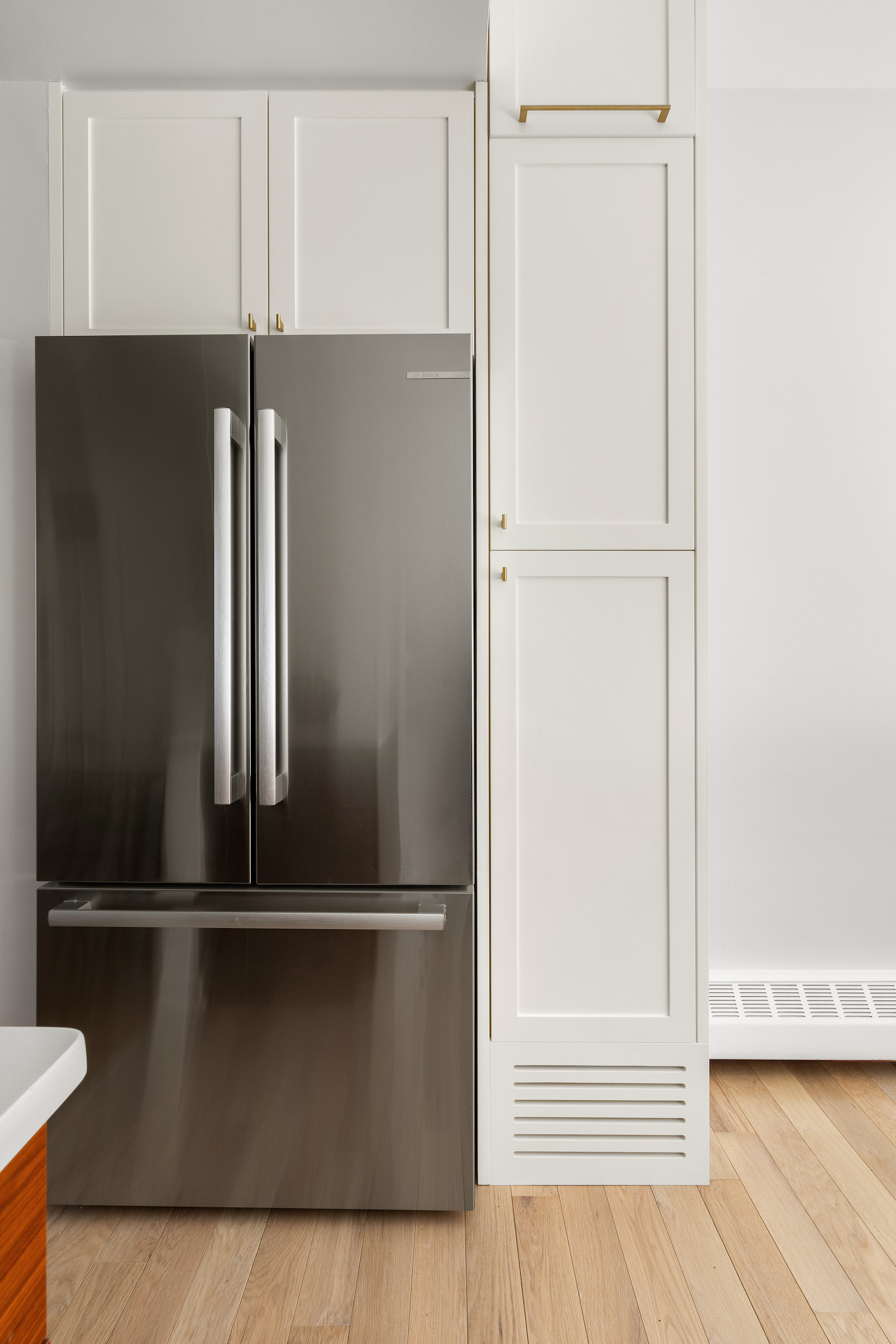 kitchen with built-in cabinets around fridge bed-stuy