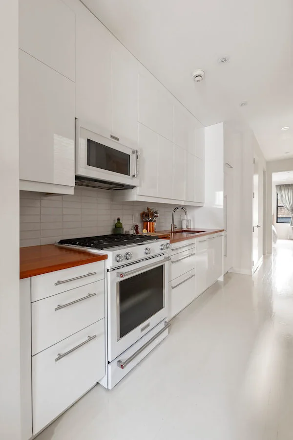 White kitchen with white floors