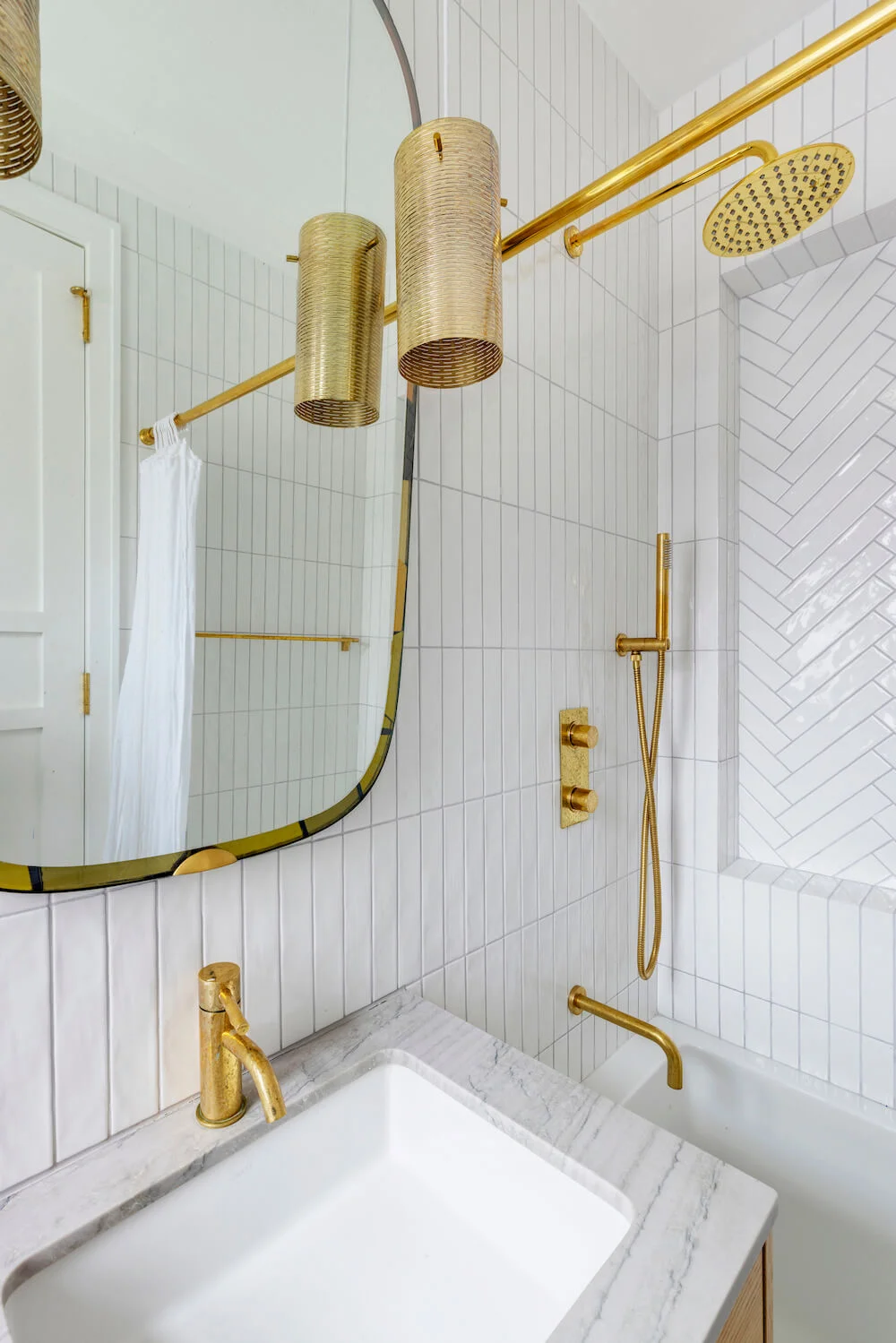 bathroom remodel with subway tile in vertical bond stack and herringbone