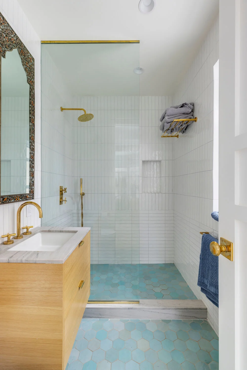 shower remodel with blue tile floors