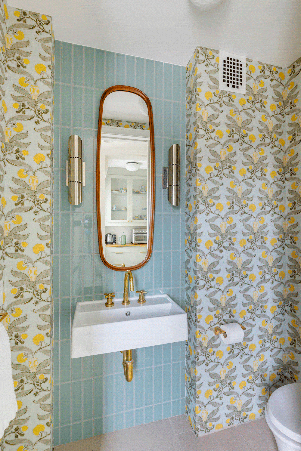 blue green backsplash bath tile and wallpaper in half bath apartment remodel on the Upper West Side