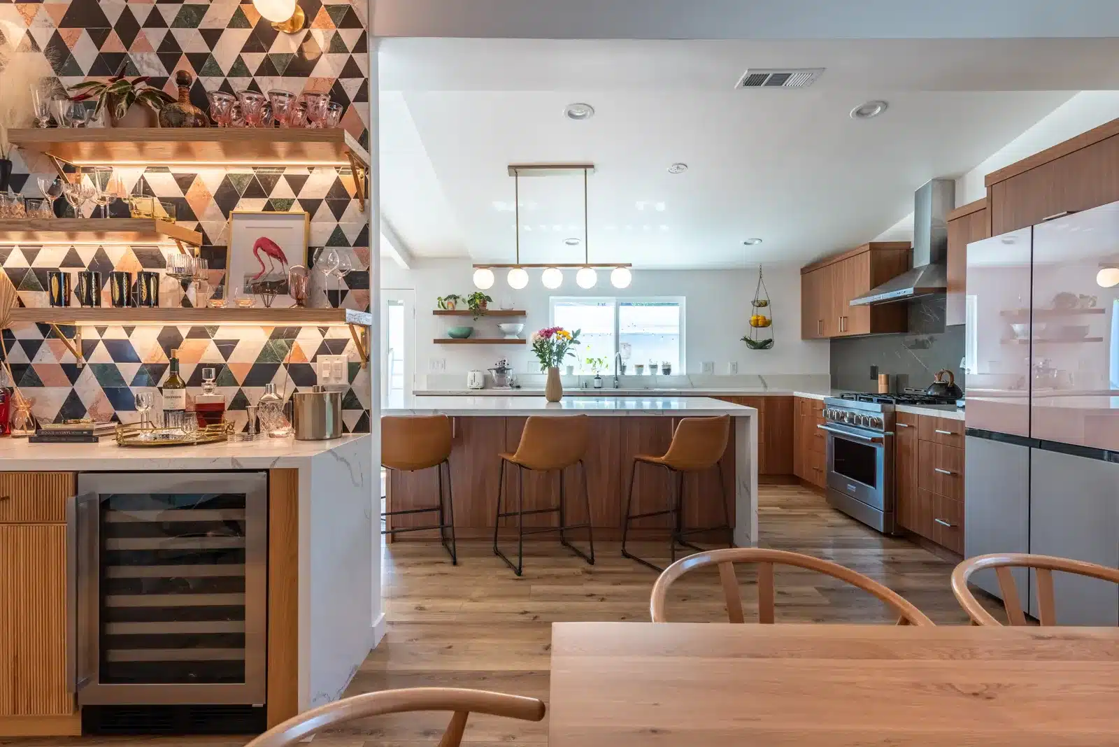 wood kitchen with island and tiled bar in home remodel in culver city