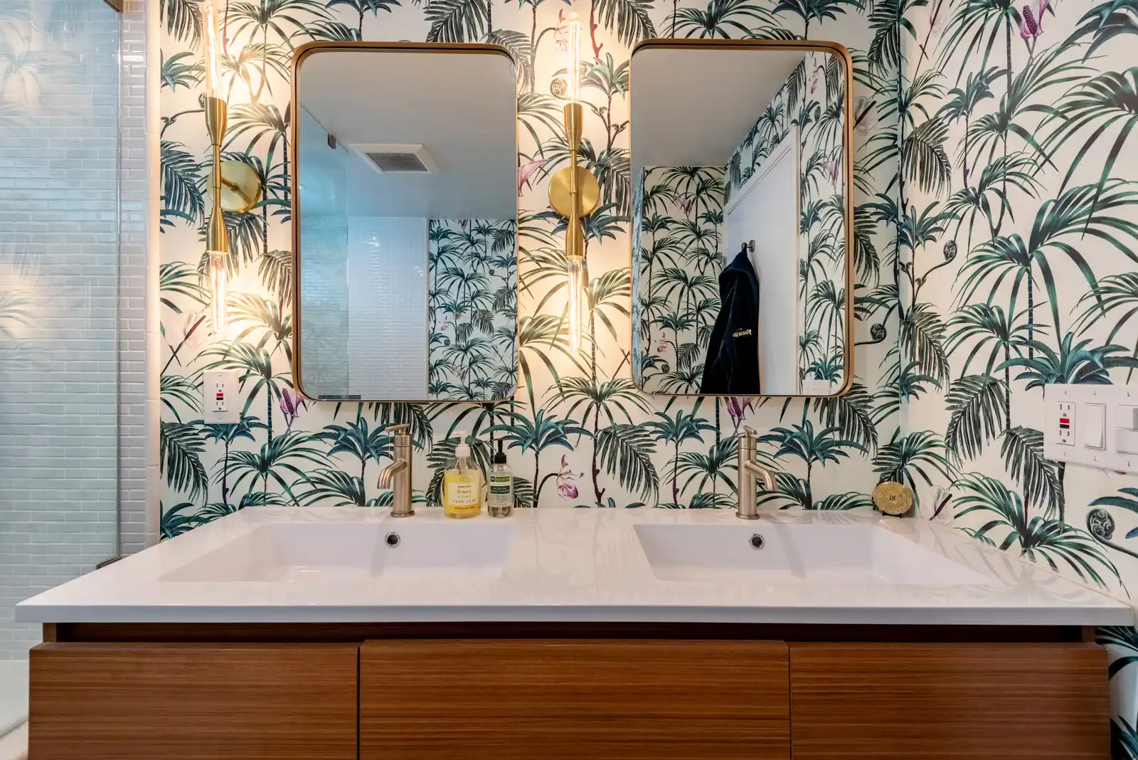 green and white bathroom wallpaper with double sinks in home remodel in culver city
