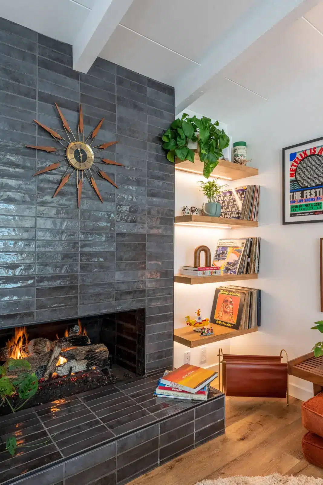 fireplace wall with elongated gray green subway tile and open shelving