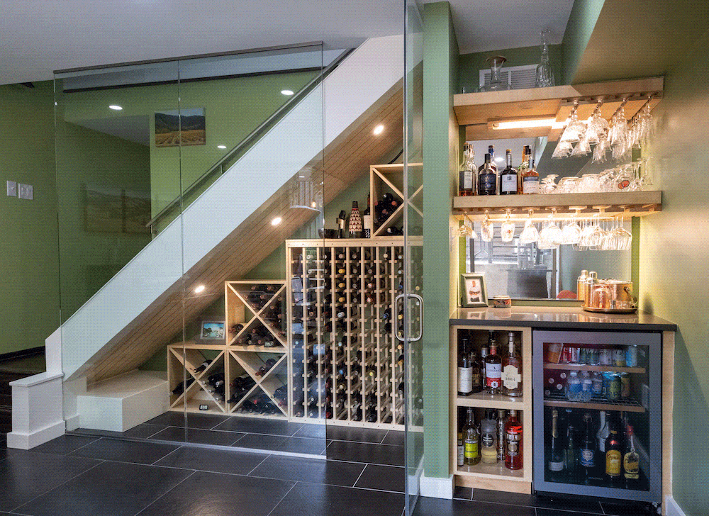 wine storage under glass enclosed staircase in basement remodel in DC